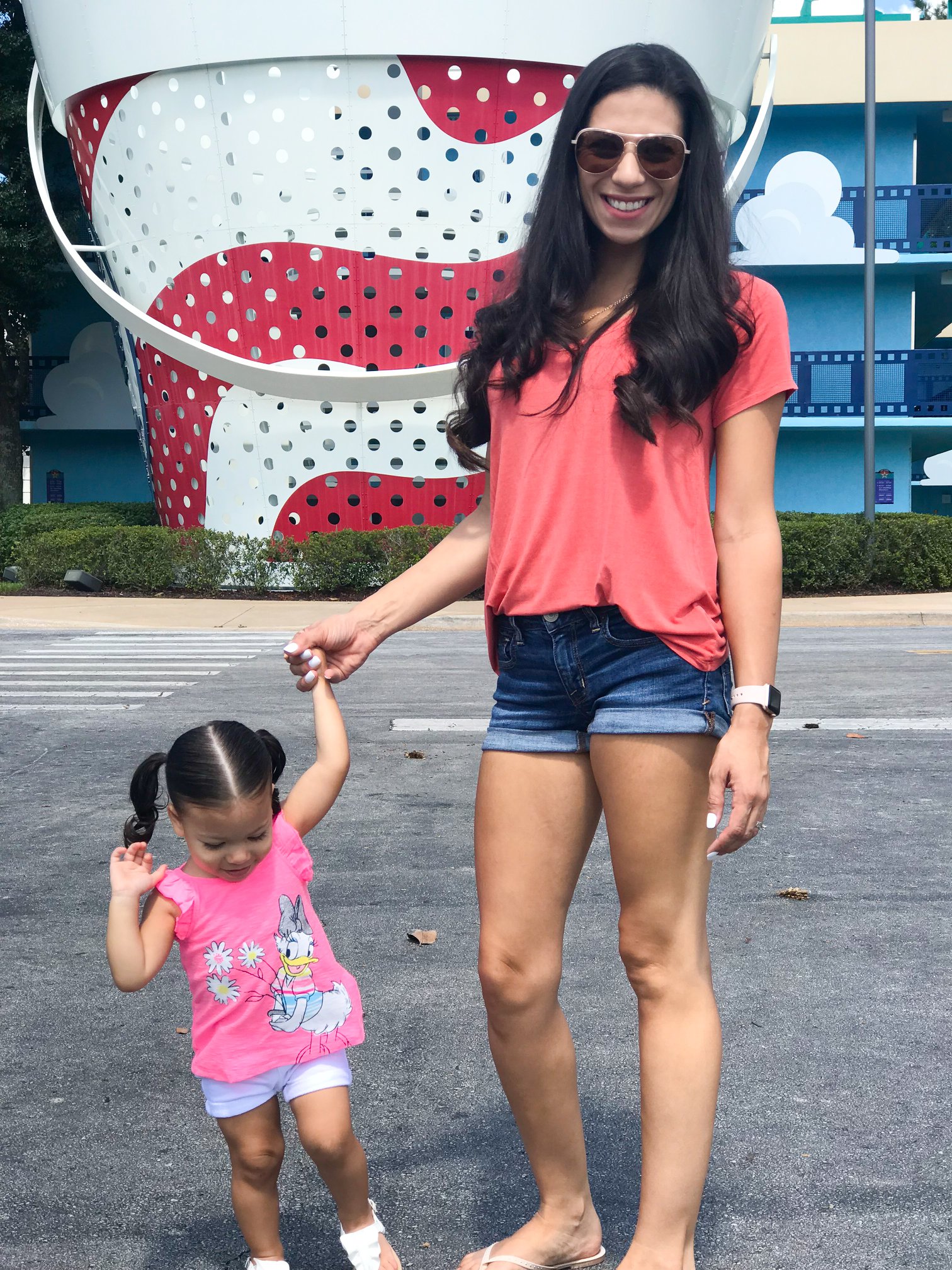 Shirlee holding a little hand at Disney